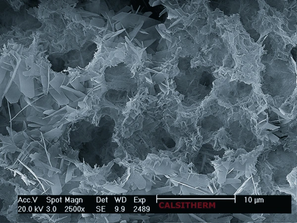 Highly porous Calcium Silicate under the microscope, 93% of the volume is air. Highly porous Calcium Silicate under the microscope, 93% of the volume is air.