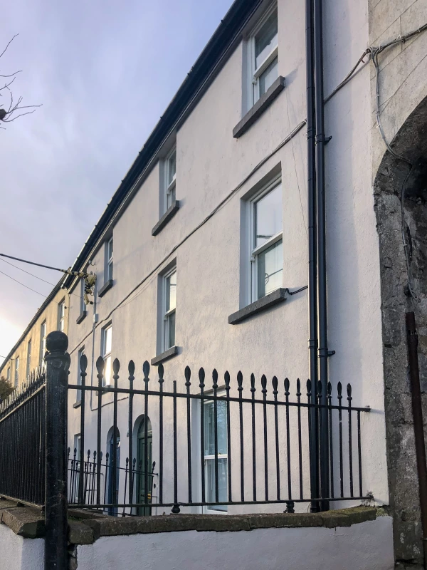 Street view of a row of period townhouses in Galway