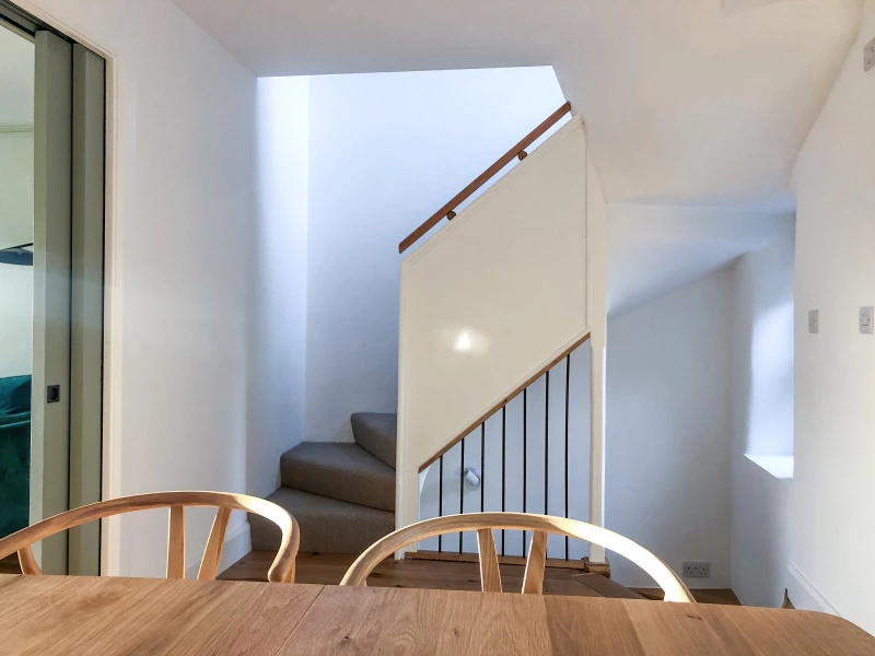 Staircase in kitchen in townhouse retrofit in Galway